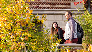 two students walking together on campus