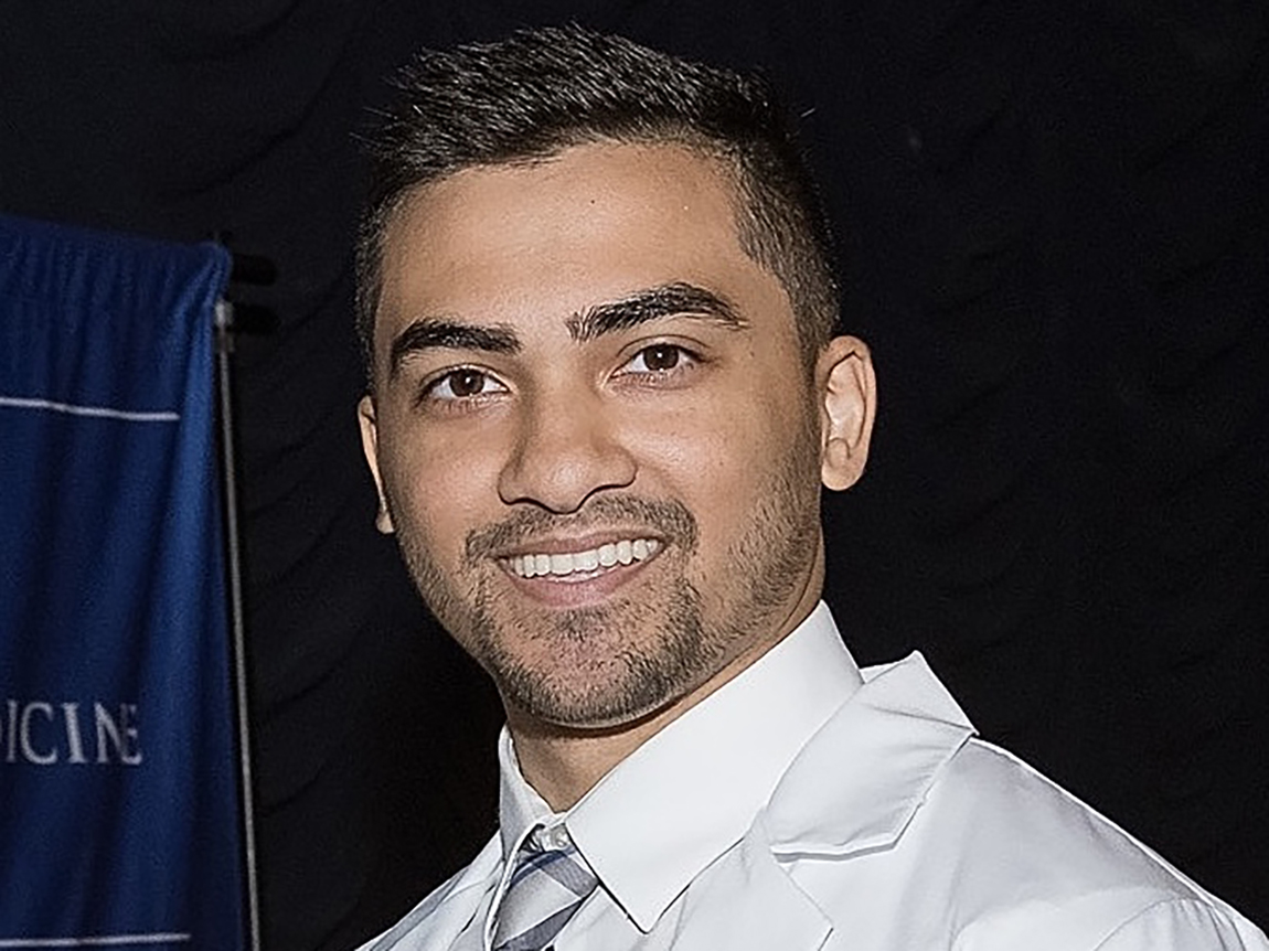 A headshot of Abrar Shamim ’20 wearing a white collared shirt and tie