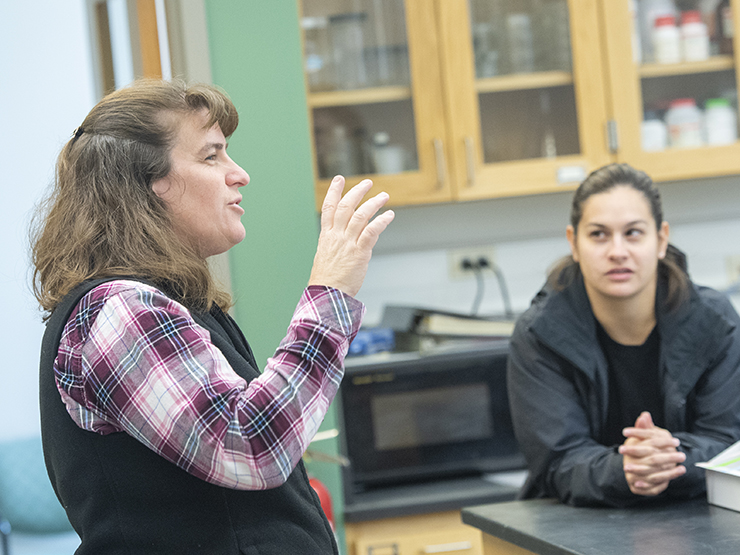 Image of teacher with students 