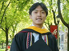 Portrait of graduating Muhlenberg student wearing event garments.