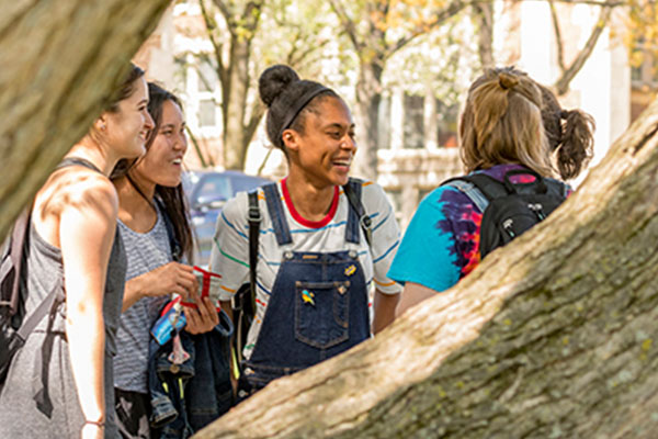 Muhlenberg College students conversing outside.