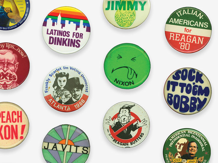 Colorful political buttons situated against a white background.