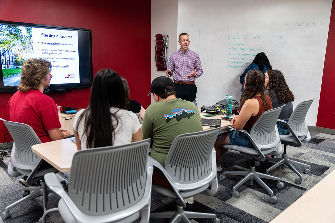 Students watch a Career Center presentation about resume building