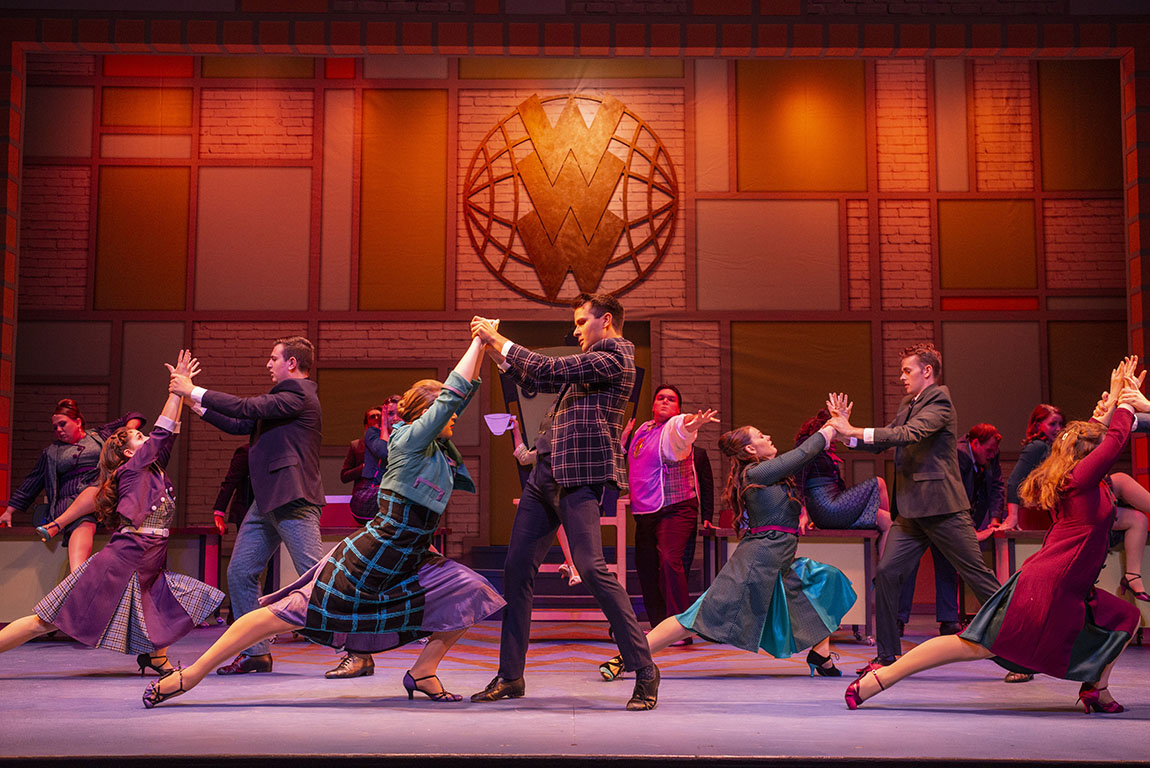 Dancers performing on stage in How to Succeed