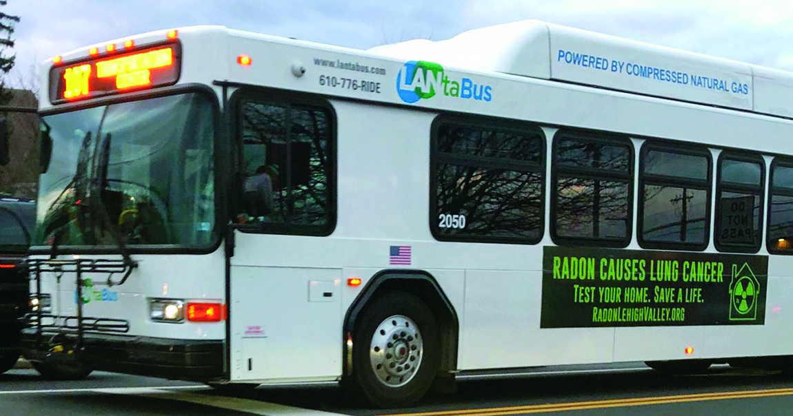 A city bus with an ad on the side that says RADON CAUSES LUNG CANCER. TEST YOUR HOME. SAVE A LIFE. radonlehighvalley.org