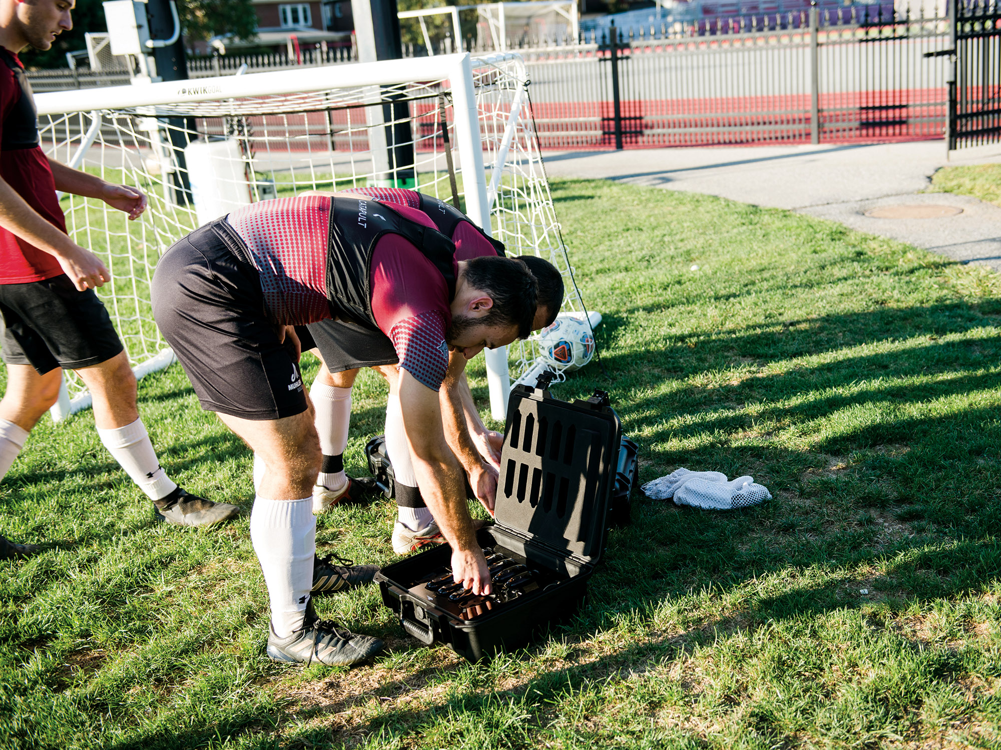 Image for GPS trackers are stored in a case when not being worn inside the soccer players’ vests. 