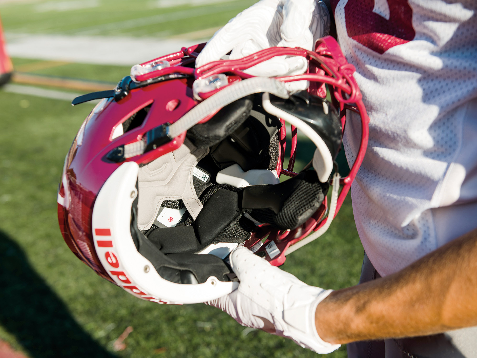 Image for An extra layer inside the helmets helps track the force and location of hits.