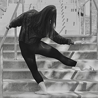Alison Bashford '20 dances on steps outdoors