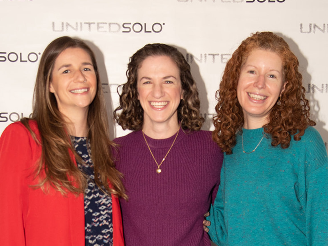 Three alumni smile at the camera: Casey Pfeifer, Becca Schneider and Jenn Haltman