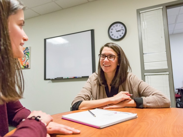 Samantha Hof, Career Center director, helps a student learn about career options.