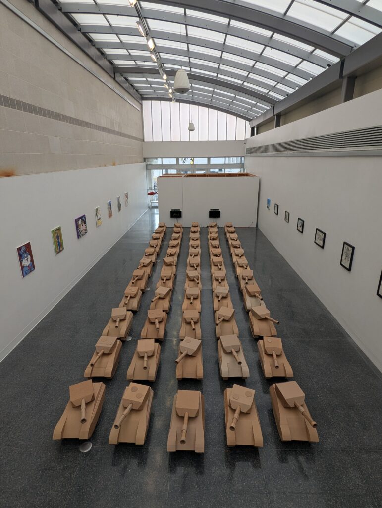 A roomful of tanks made of cardboard.