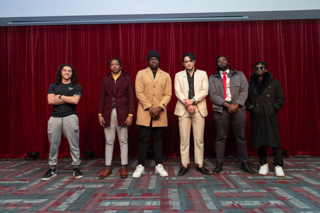 Six college students pose during a fashion show