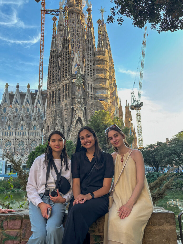 Three students in front of church in Barcelona
