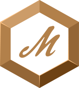 A hexagon-shaped bronze badge with a bronze colored "M" in the middle