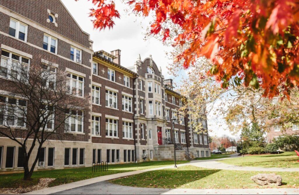 Campus building and fall leaves
