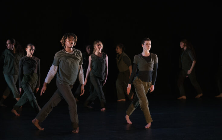 A group of college students perform a chroeographed dance