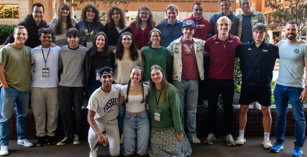 A group of college students poses for a group photo