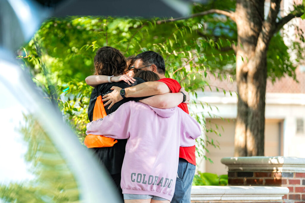 Welcome Weekend and Orientation A Muhlenberg College family hugs during orientation