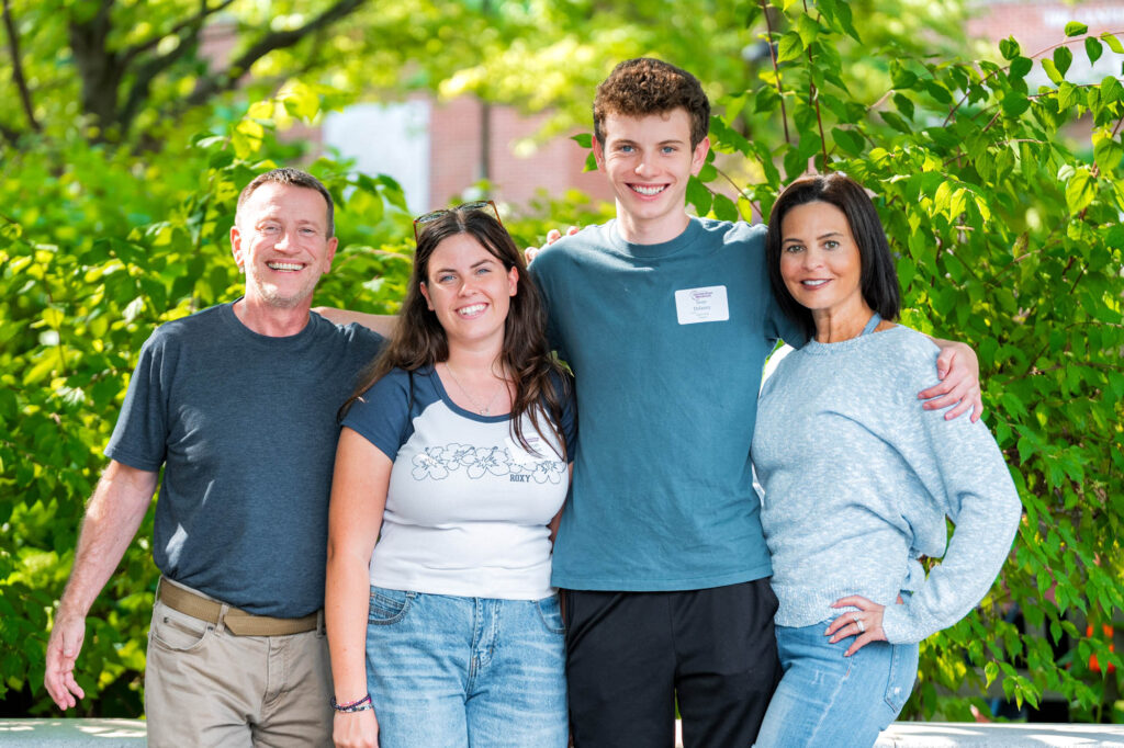Two Muhlenberg College parents with a student and his sibling during orientation