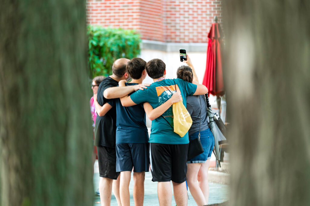 A Muhlenberg College family takes a selfie during orientation