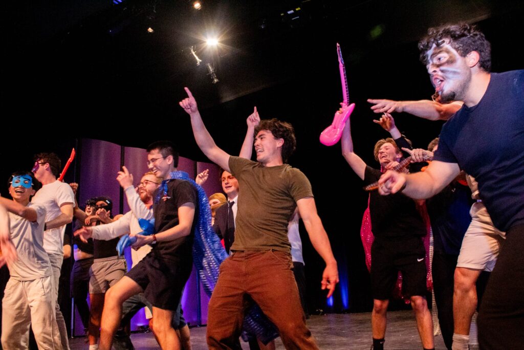 A group of fraternity brothers participate in a lip synching competition