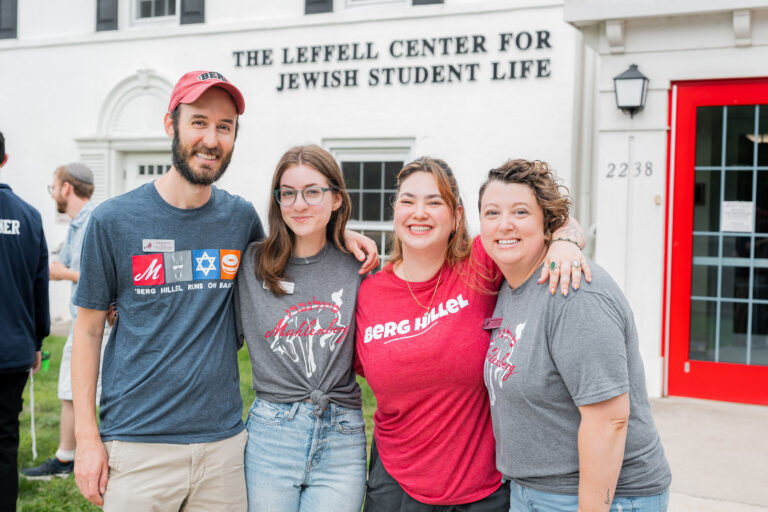 The staff of the Leffell Center for Jewish Student Life pose for a photo outside the building