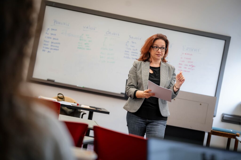 Ioanna Chatzidimitriou, Muhlenberg faculty, speaks in front of a classroom.