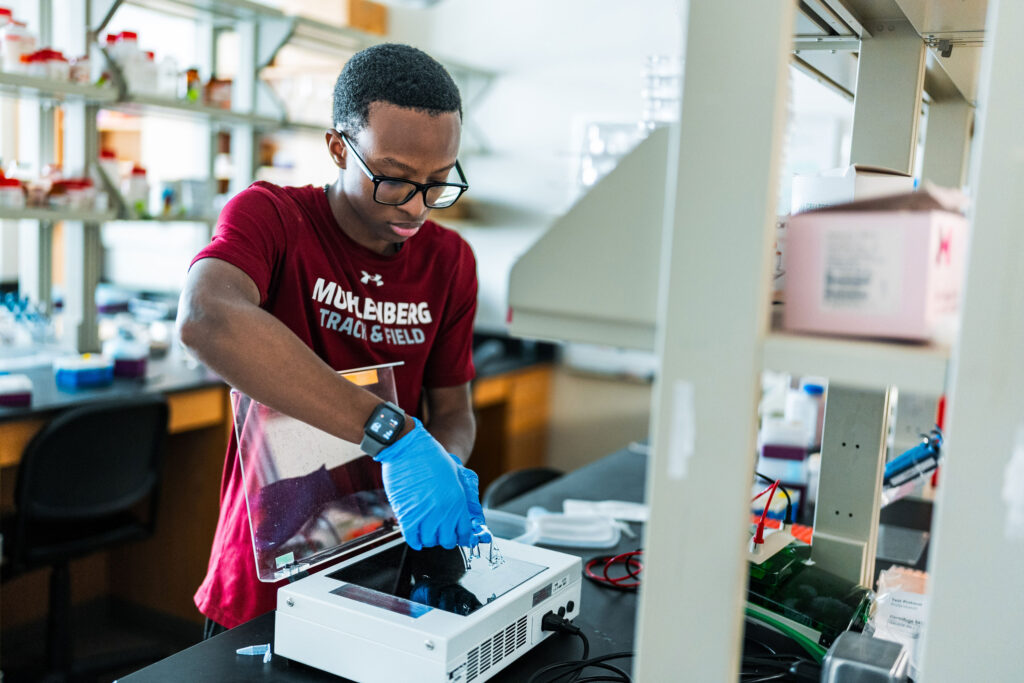 A Muhlenberg College student works in a biochemistry lab