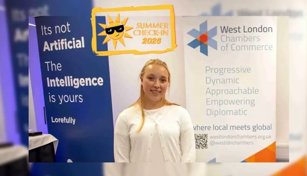 Katie Zarish-Yasunas in front of West London Chamber marketing sign