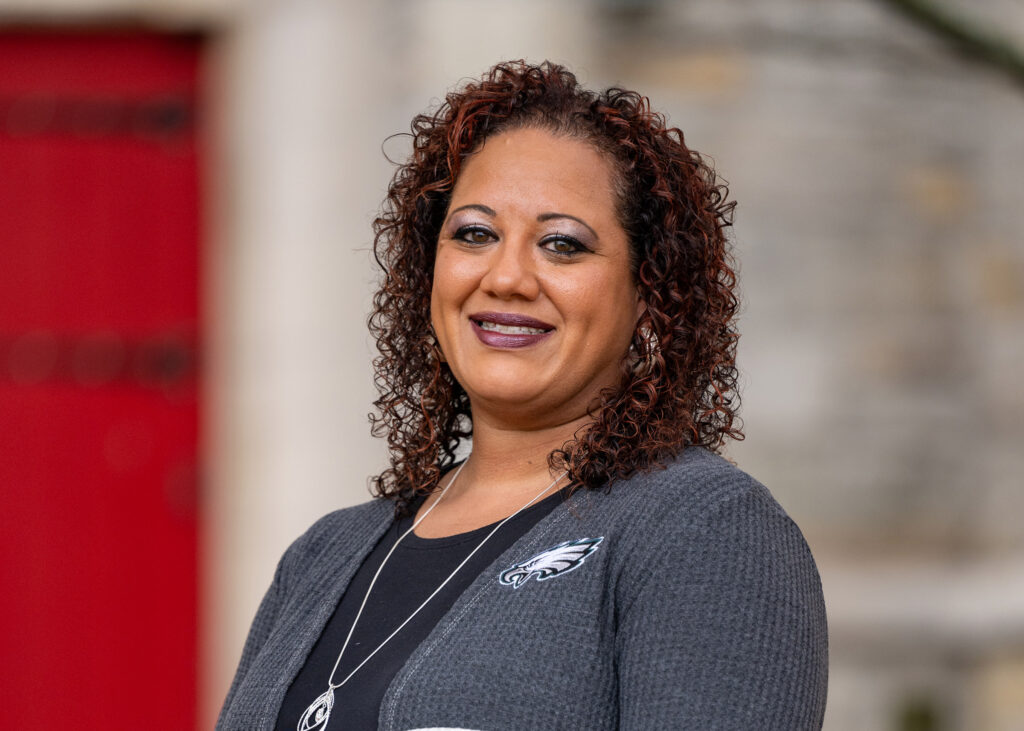 Portrait photo of Marci Martinez-Howey smiling