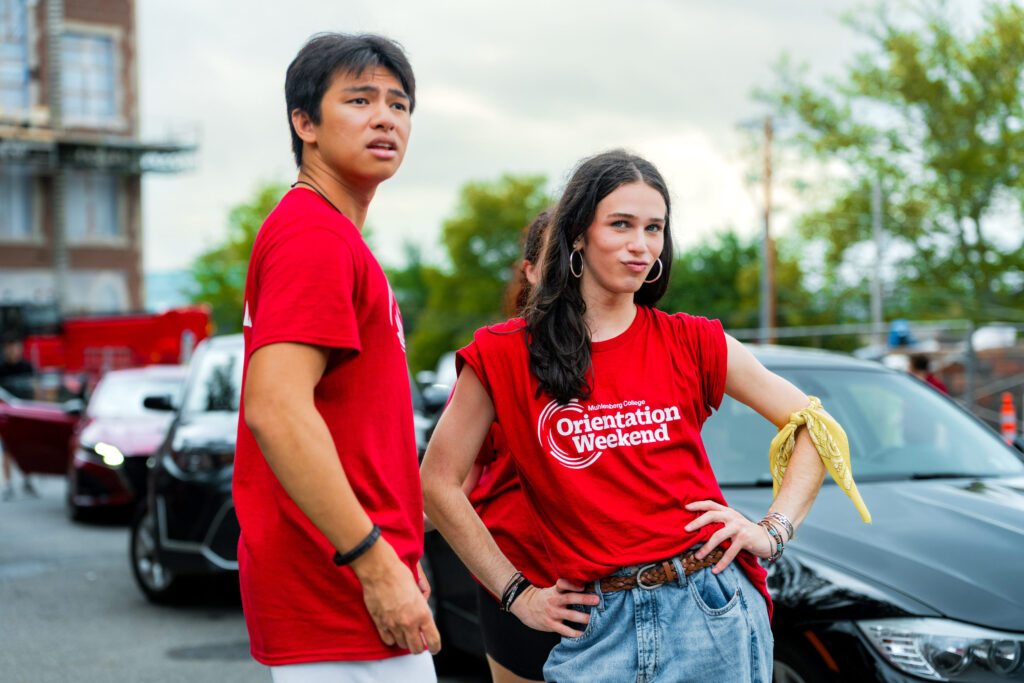 Two Muhlenberg College students in red shirts pose during move-in