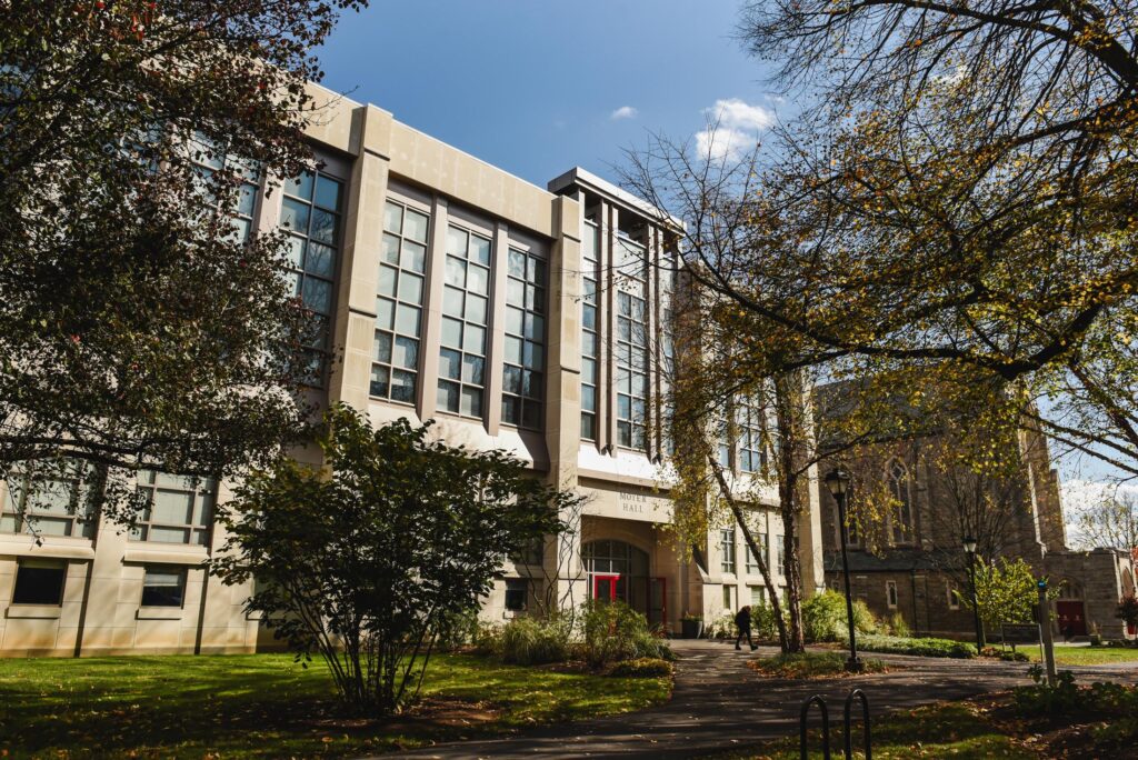 Exterior view of Moyer Hall through the trees