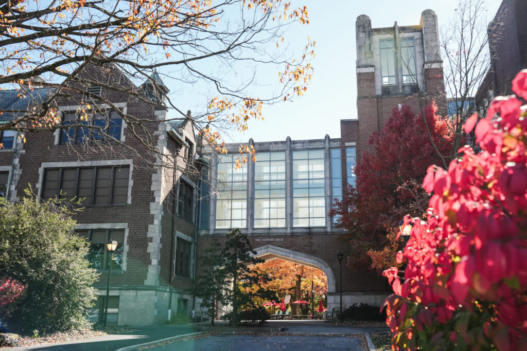 A brick arch connecting two academic buildings