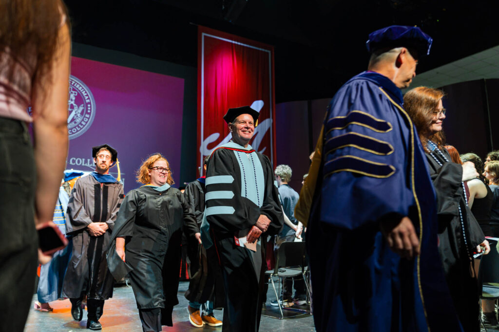 Muhlenberg College faculty walk in academic regalia