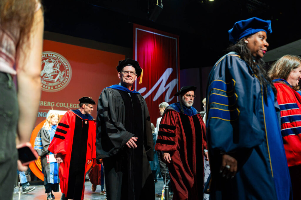 Muhlenberg College faculty walk in academic regalia