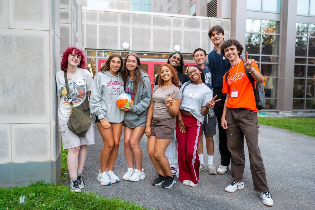 A group of college students poses during orientation
