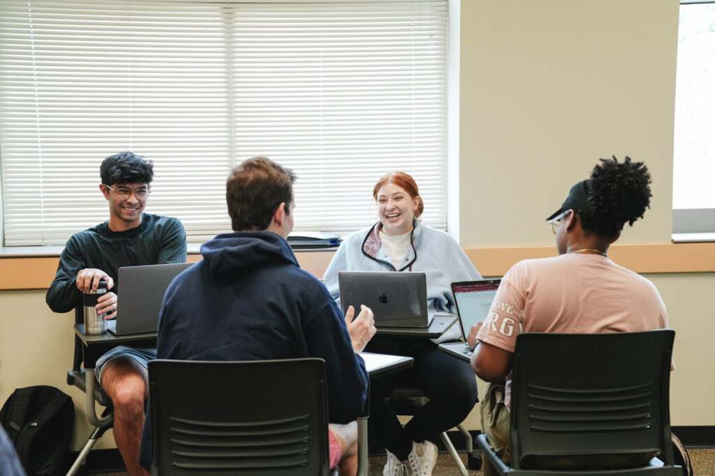 Muhlenberg students chat in a small group during a philosophy class.