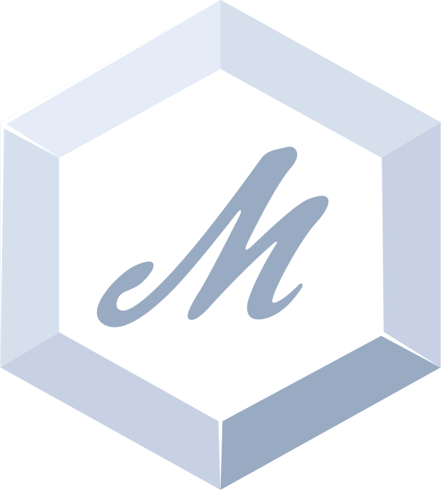 A hexagon-shaped platinum badge with a gray "M" in the middle