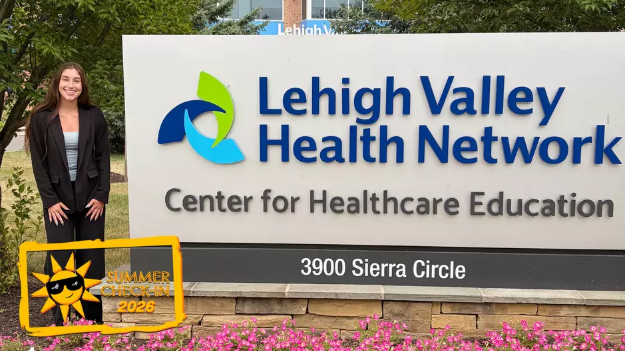 Rachel Hager stands by Lehigh Valley Health Network sign