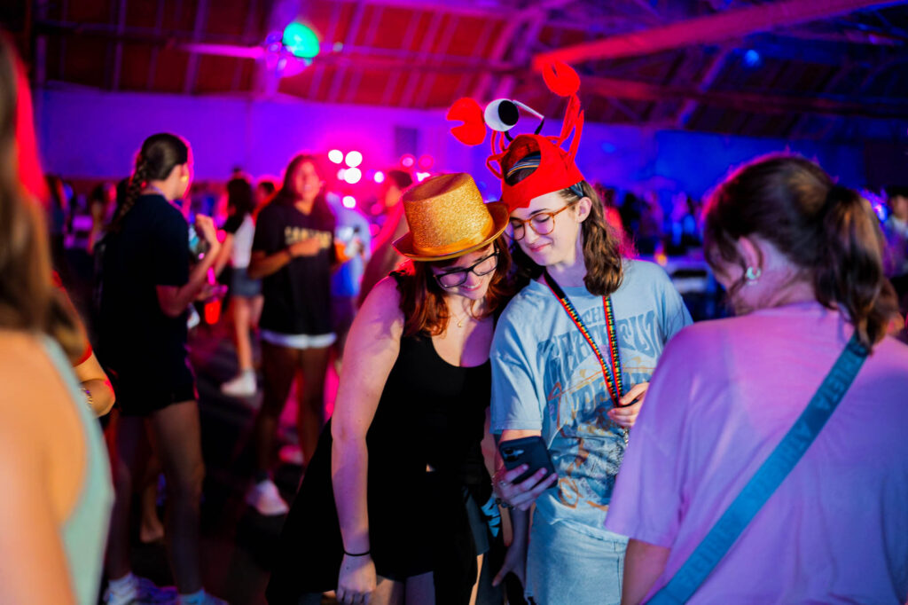 Two Muhlenberg College students in silly hats take a selfie