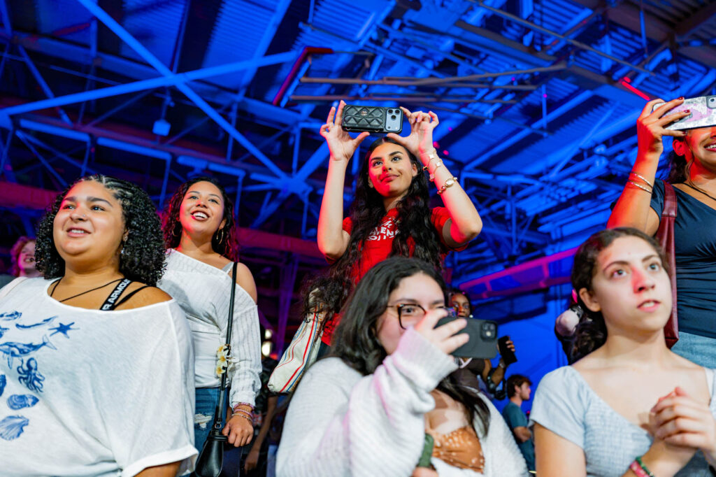 Welcome Weekend and Orientation New Muhlenberg College students take photos with their phones during a welcome party