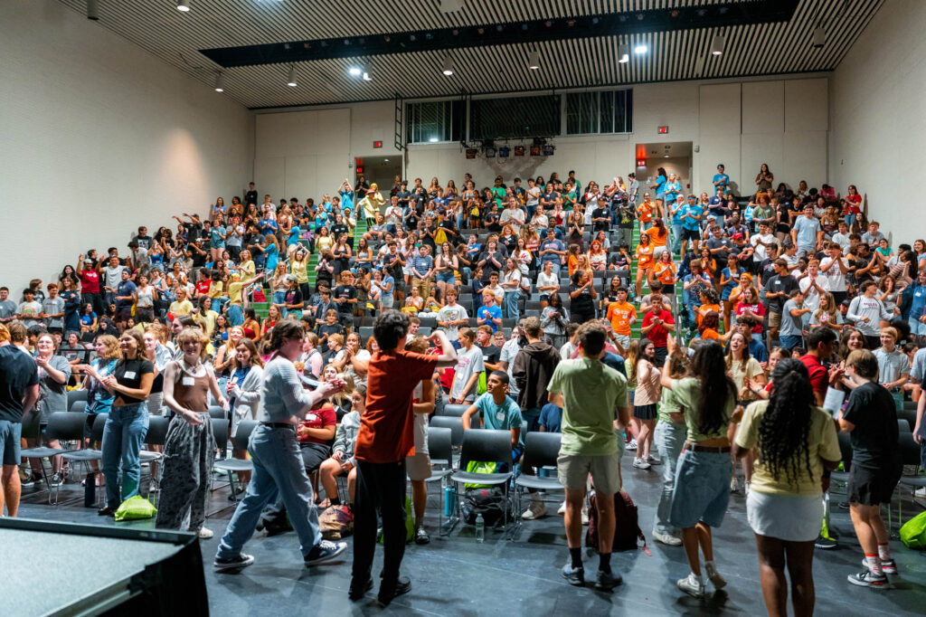 An auditorium full of Muhlenberg College students during orientation