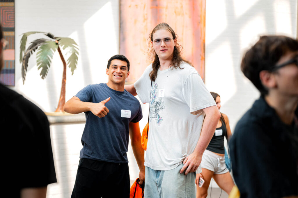 Two new Muhlenberg College students smile for a photo during orientation