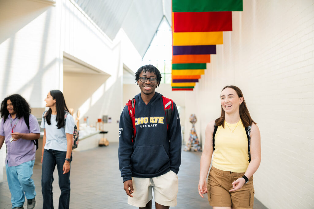 Muhlenberg students chat while walking the hallway of the Baker Center for the Arts.