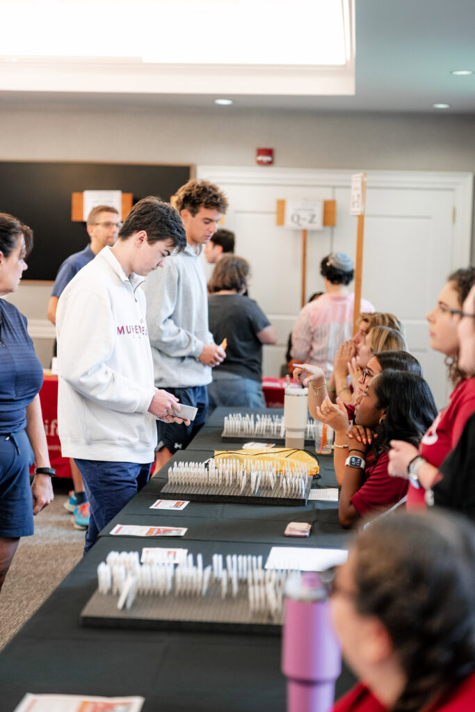 College students check in to receive their room keys