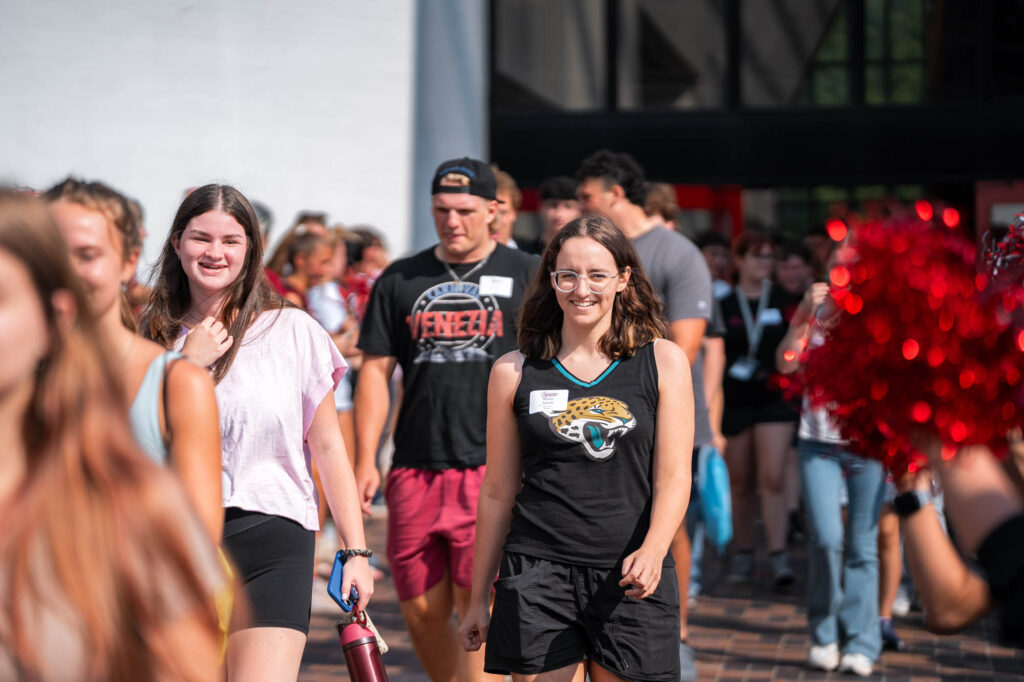 New Muhlenberg College students walk between events during orientation