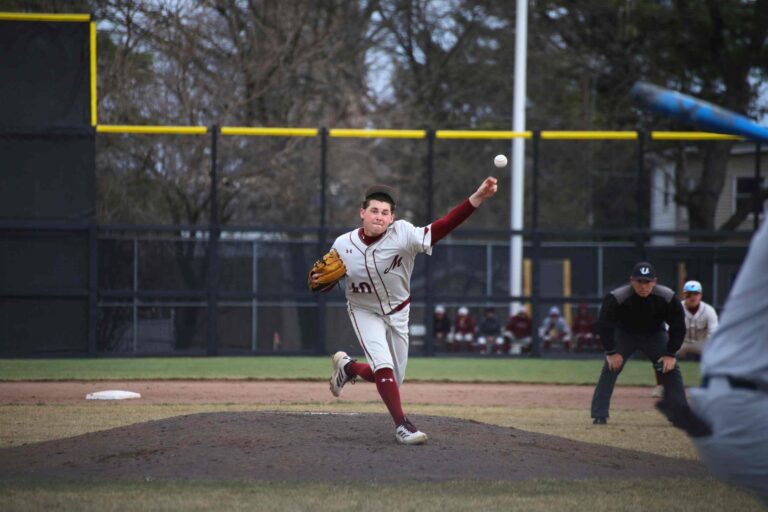 Mule Baseball pitcher throws a ball on opening day at Bicentennial Park.