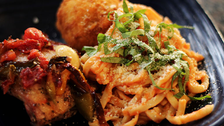 Dining Services Creamy pasta topped with basil and parmesan cheese